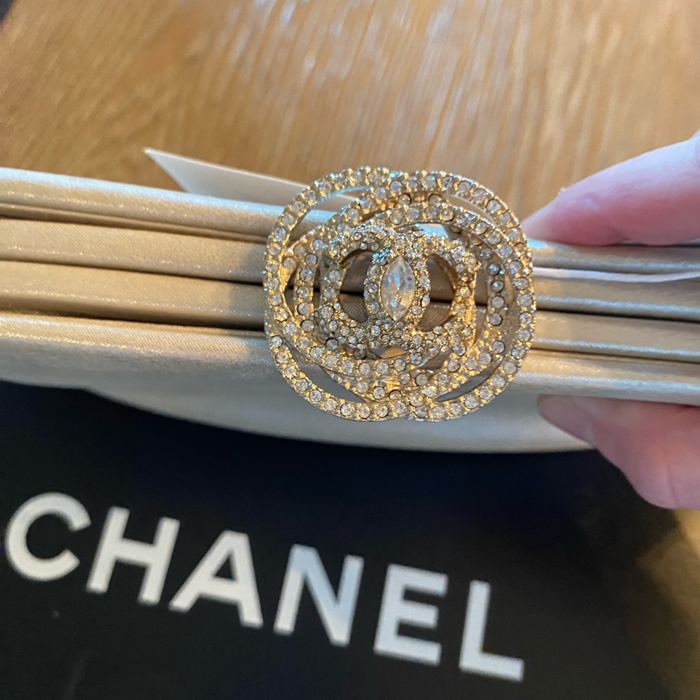 MUST GO!!!AUTH. RARE CHANEL Gold Iridescent Fabric
Swarovski Crystal Camellia